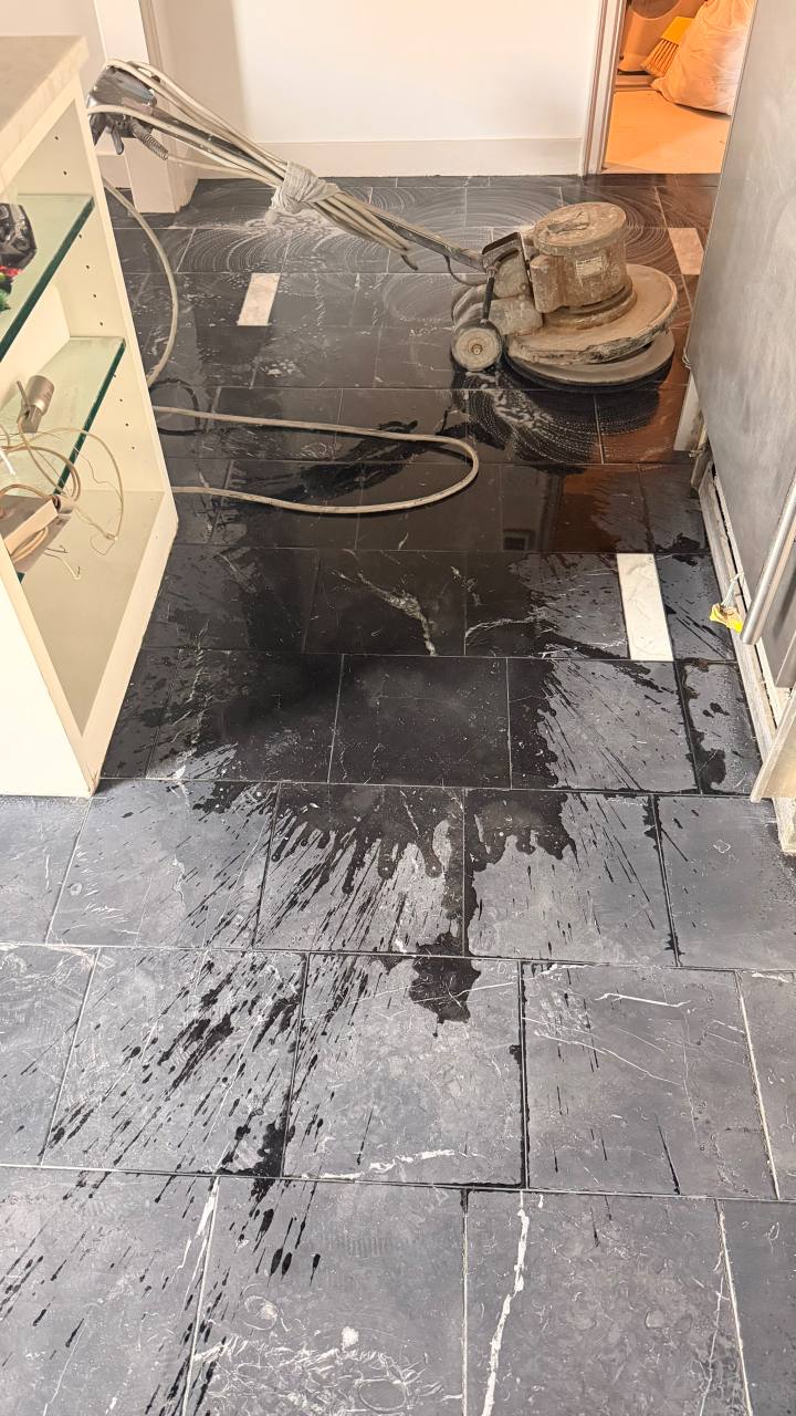 Professional honing and polishing of a Nero Marquina kitchen floor