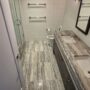 Stone Shower Curb Repair and Bathroom Floor Restoration